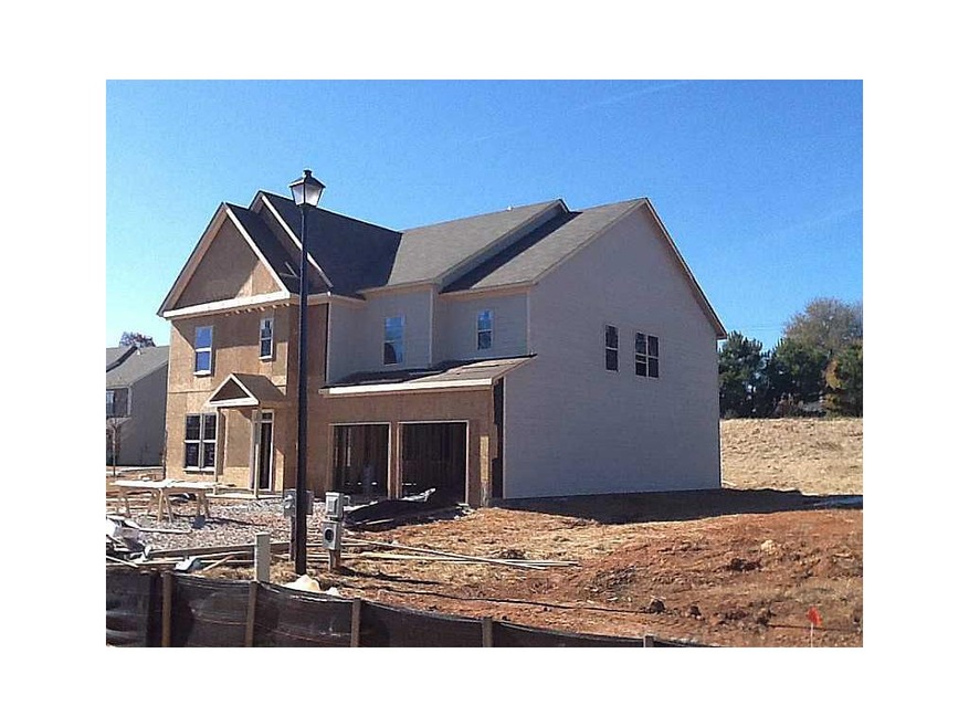 Exterior Front. Brick is halfway done and