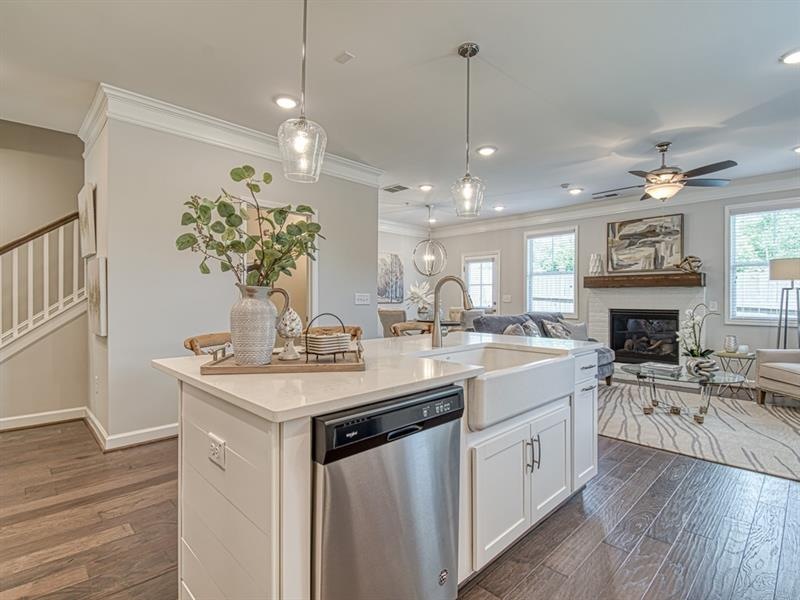 Open concept floor plan with island in kitchen.
