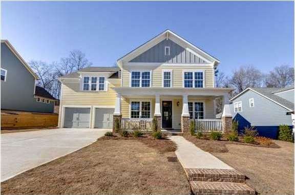 Exterior Front. Yellow and gray exterior present a