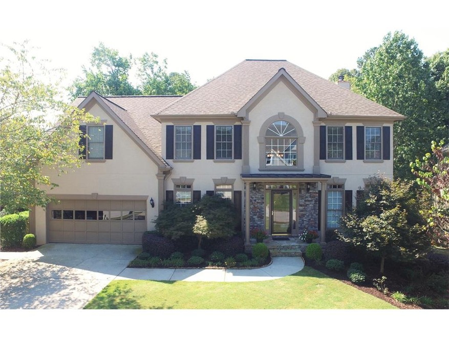 Hard-coat stucco with stone accent exterior create