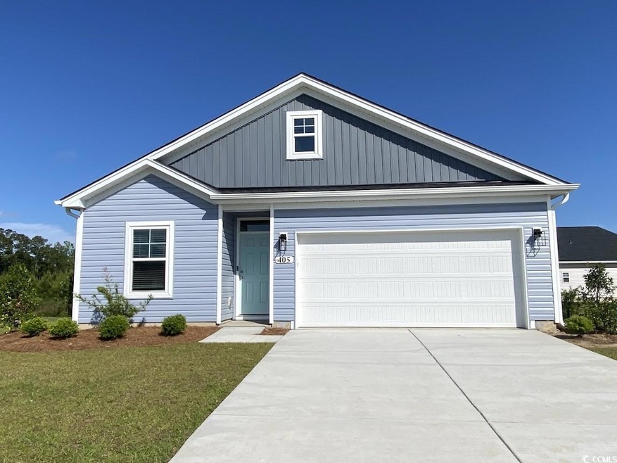 View of front of house with driveway, a garage, an