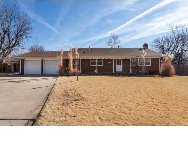 Brick front, 1114 Lawrence Court. Home sits in bac