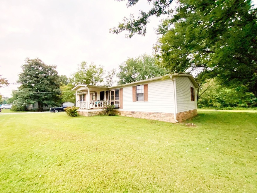 HO-HO-HO! Come check out this As-Is Handyman Special that needs some TLC for Christmas! The home sits on a nice, level, large lot and has a Detached Block Building that adds value. It would be a nice renovation or could work as a rental too! 