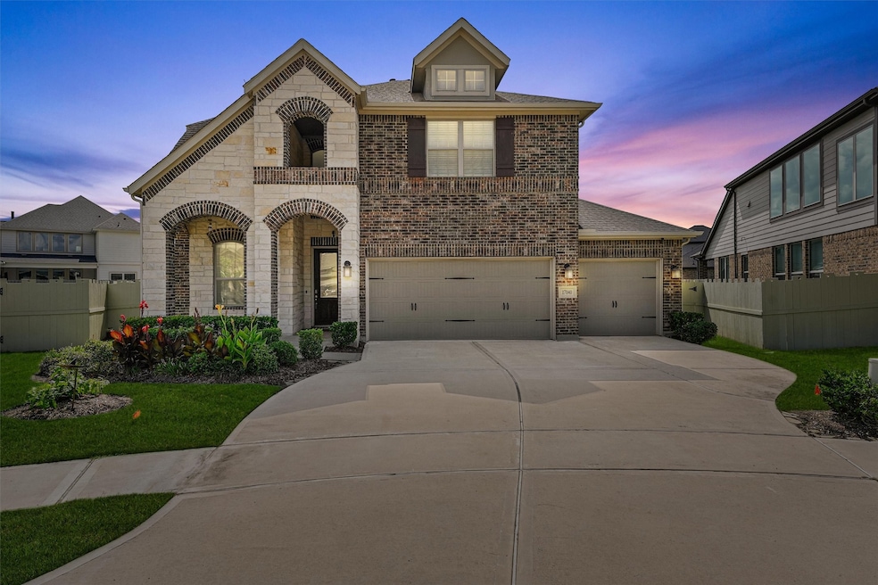This charming two-story home features a brick and