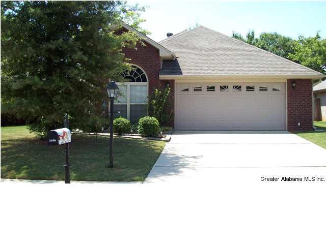 Well landscaped front lawn and garden add to the b