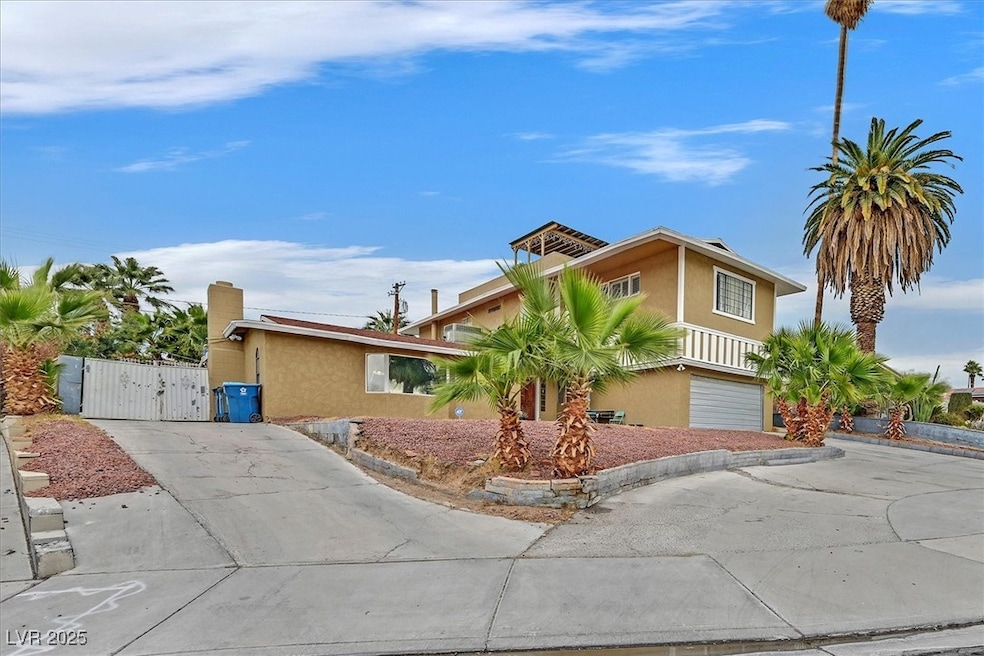 View of front of home with driveway, an attached g