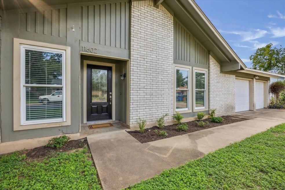 View of exterior entry featuring brick siding, an