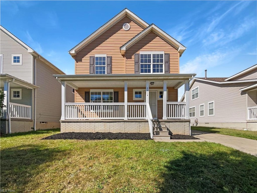 View of front of house featuring a front yard and a porch