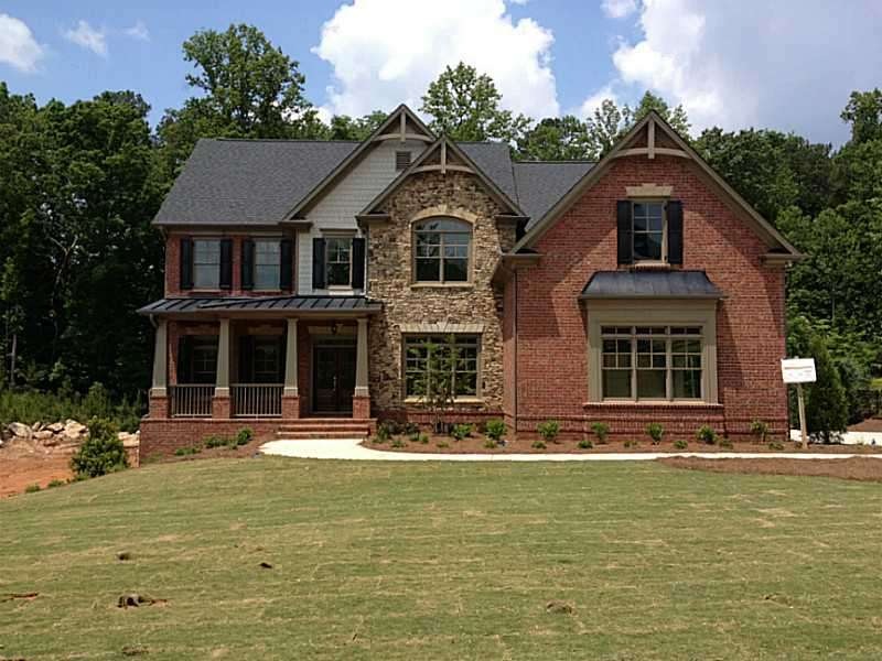 Exterior Front. THREE SIDES BRICK/STONE AND HARDIP