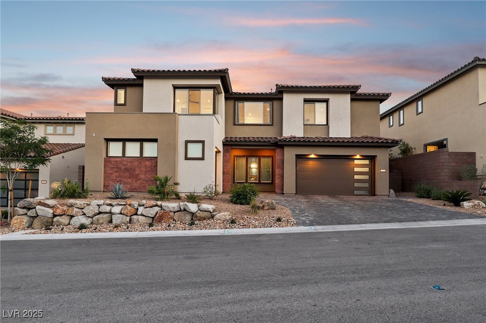 Twilight view of front of home with modern exterio