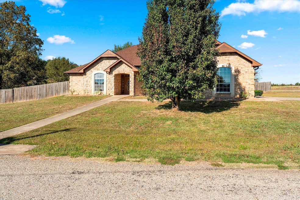 View of front of property with stone siding and brick siding