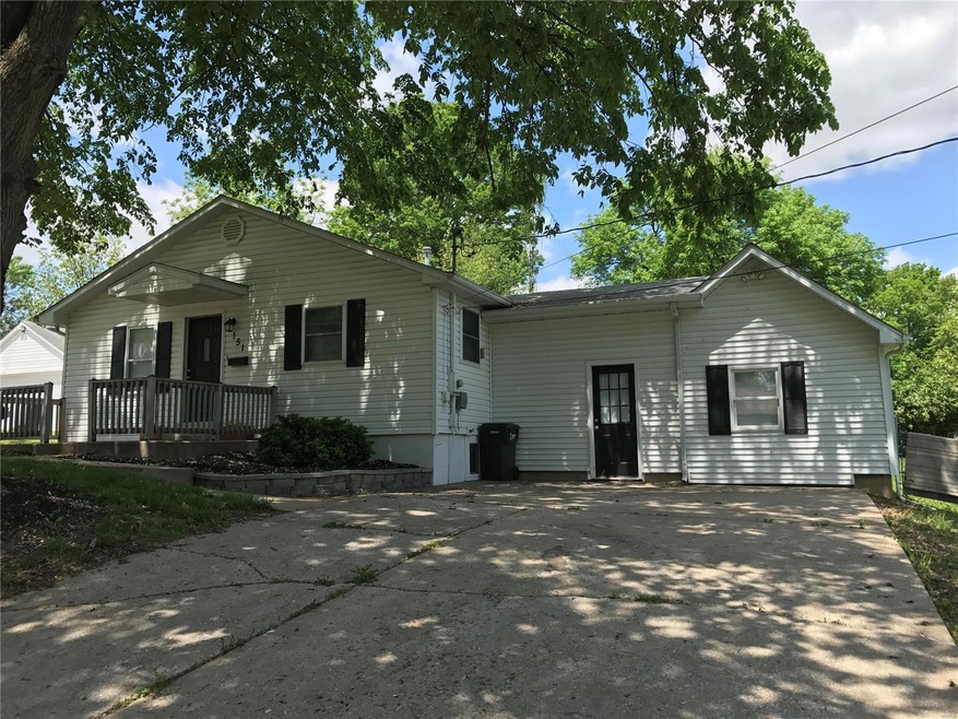 Lovely shaded front porch and home.