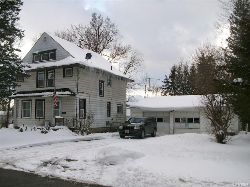 Right side of house showing 2.5 car det garage