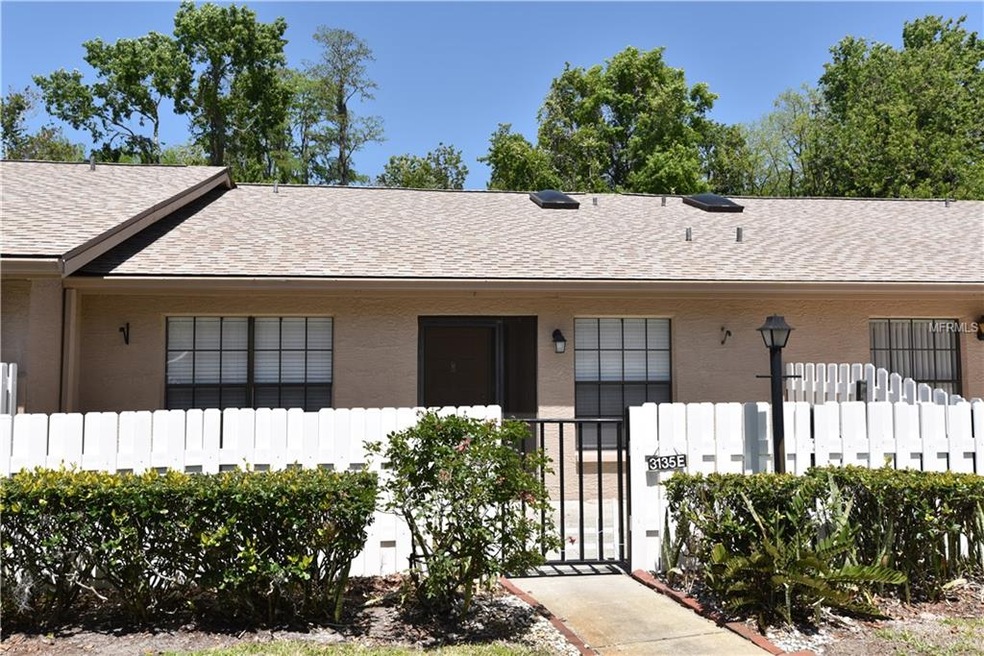 LARGE FENCED IN FRONT PATIO MAKES A GRAND ENTRANCE