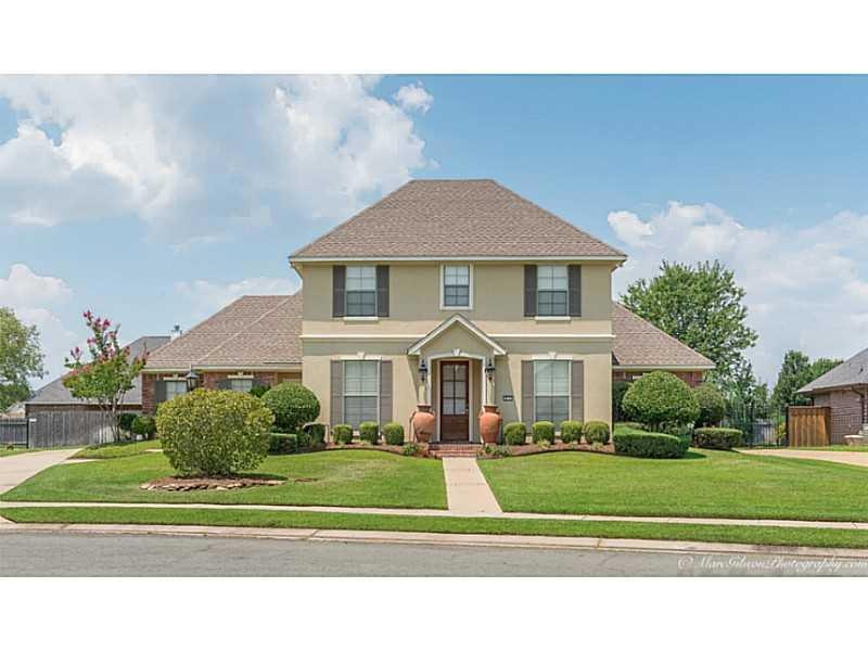Photo. Home is located on a large lot in gated com