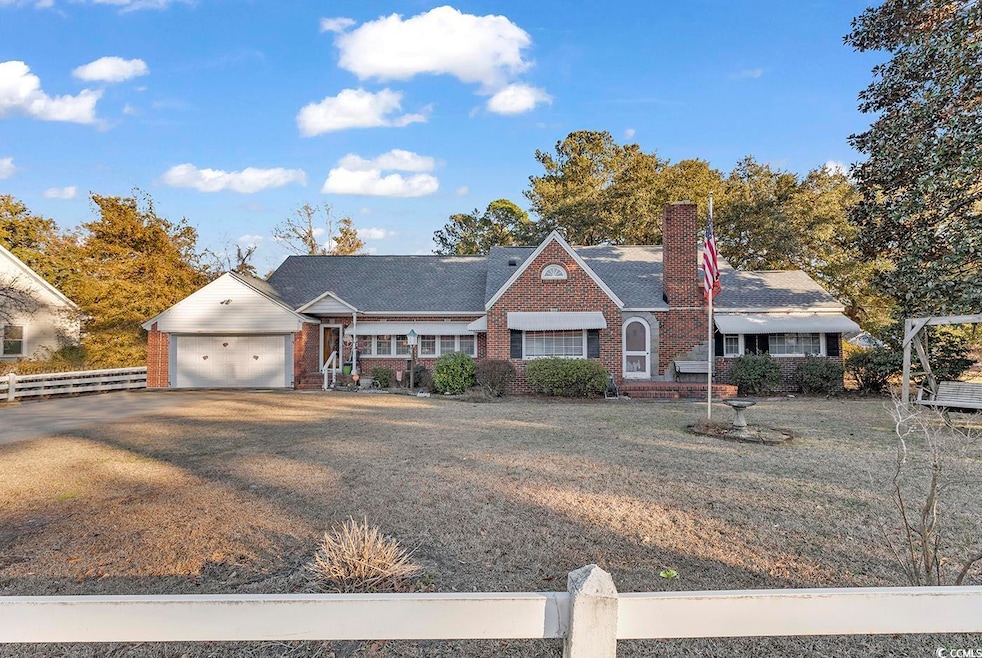 View of front of property featuring a garage and a