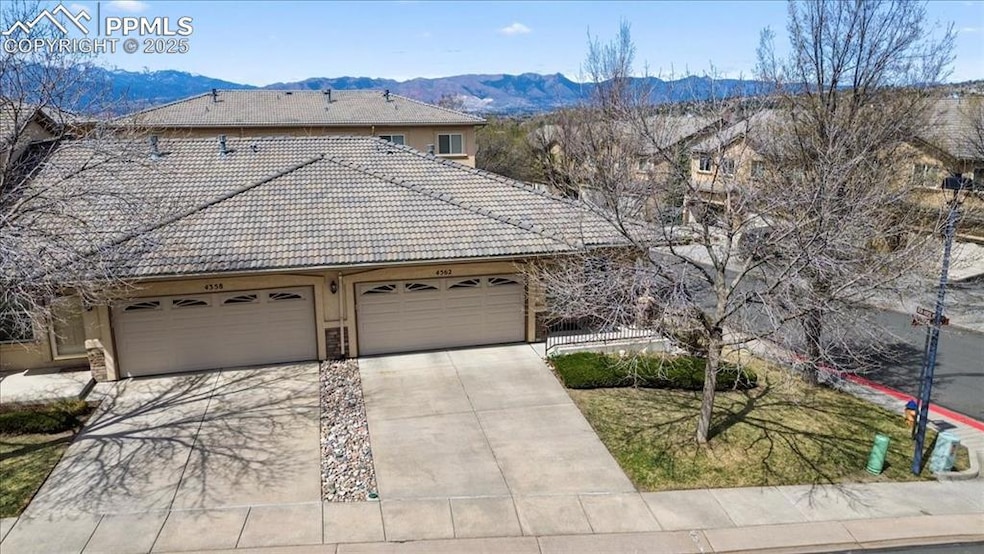 View of front of property featuring a tiled roof, 