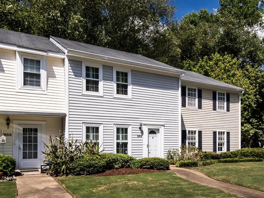 Nicely landscaped front with No-Step entry.