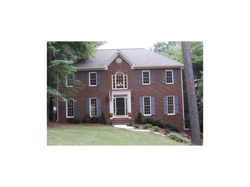 Exterior Front. Elegant Brick Traditional