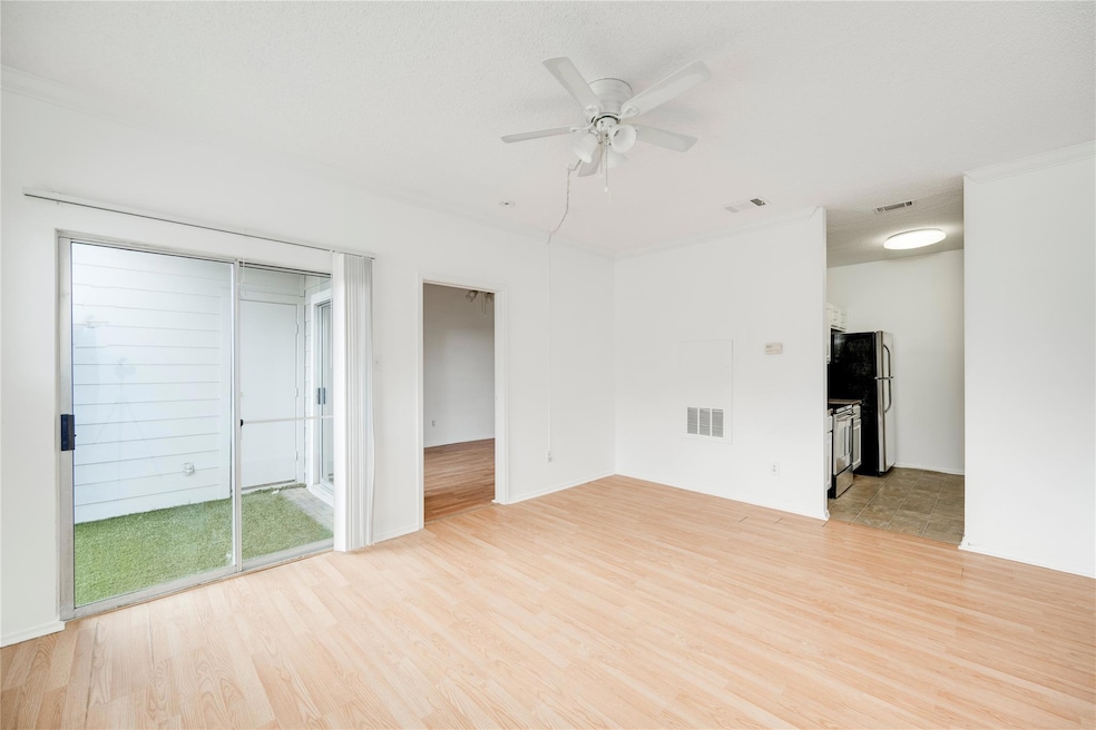 Unfurnished living room with visible vents, light