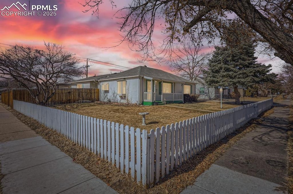View of front of house with a fenced front yard, a