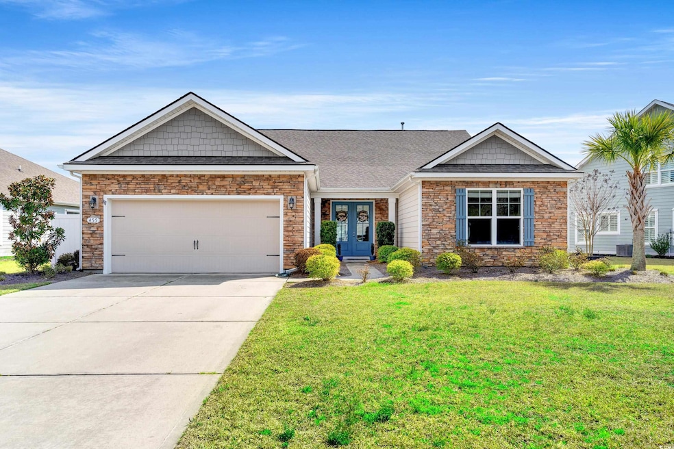 View of front of home featuring a front lawn, roof