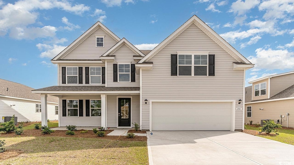 View of front of house with a garage, concrete dri