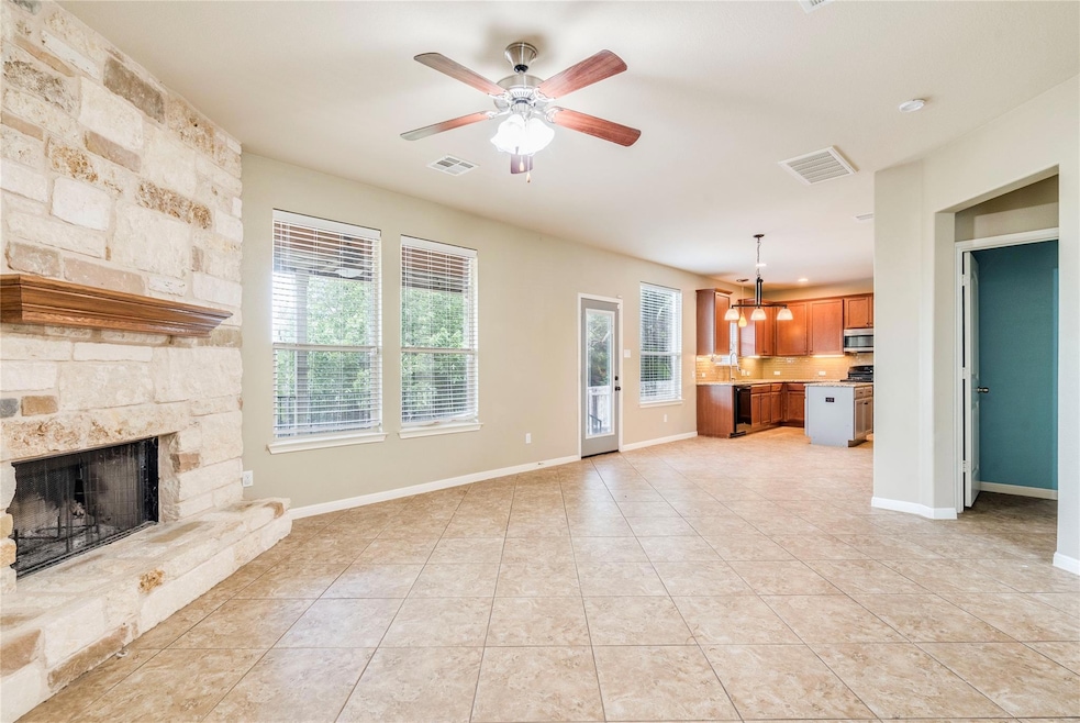 Unfurnished living room with ceiling fan, light t