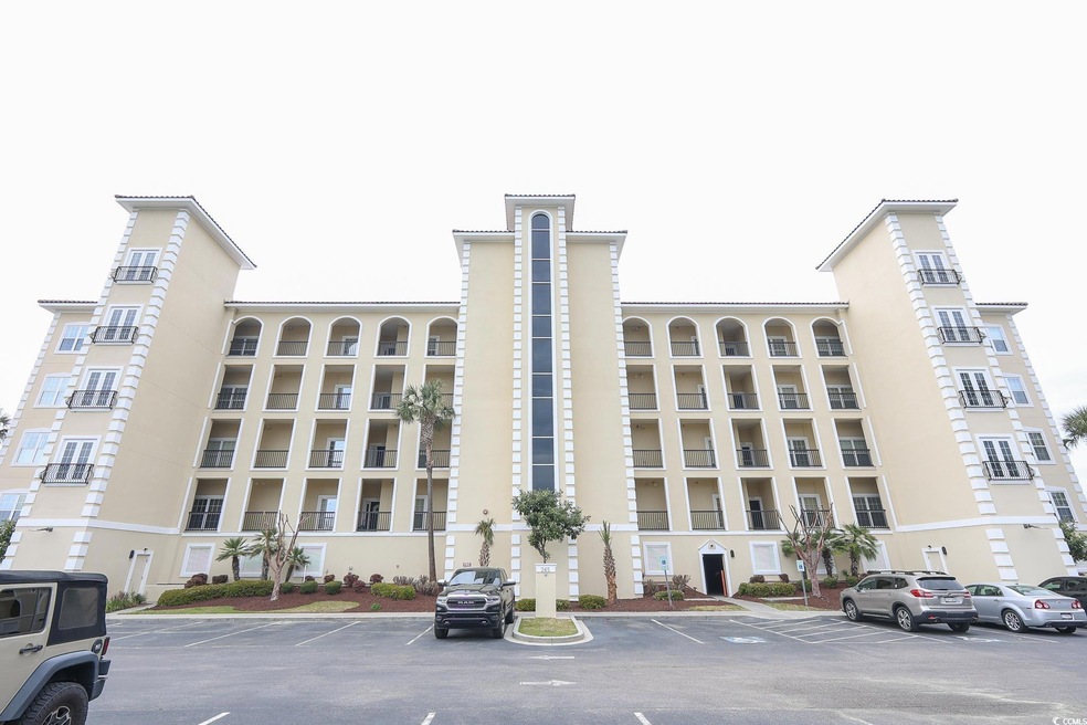 View of building exterior featuring uncovered park