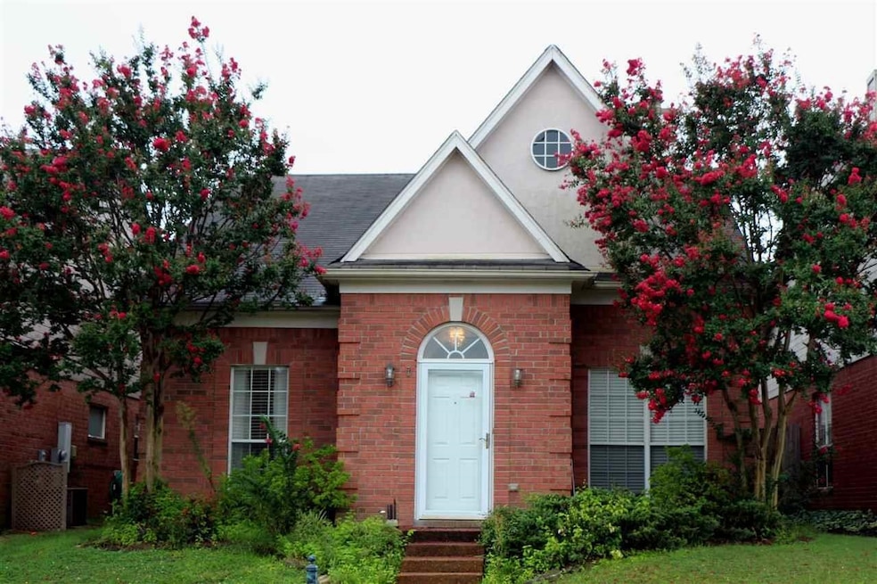 Traditional-style house featuring stucco siding an