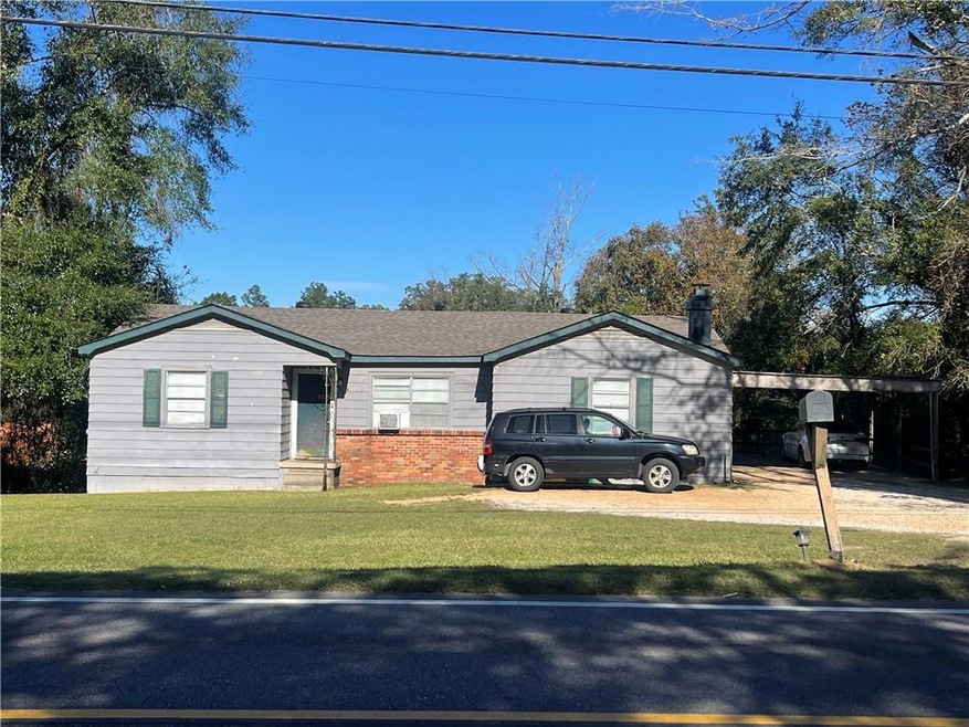 View of front of property with a front yard and a 