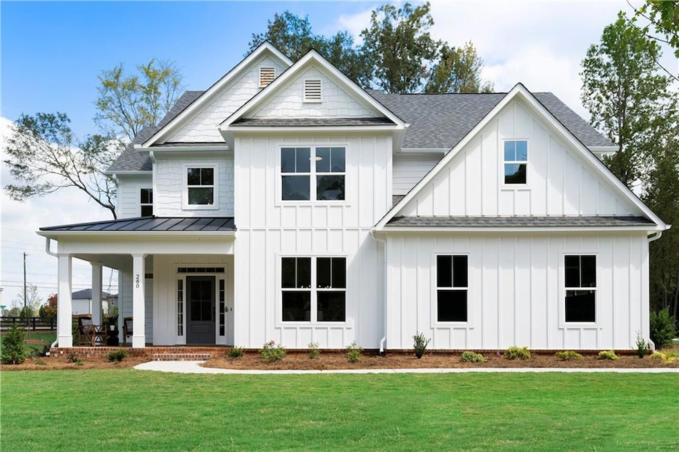View of front of home featuring a porch and a fron