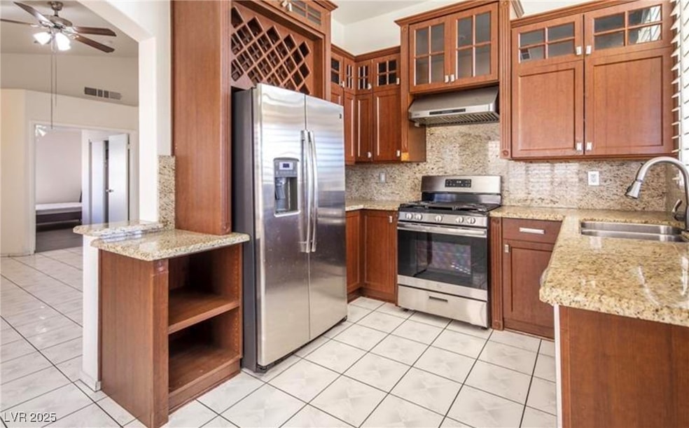Kitchen with stainless steel appliances, exhaust h