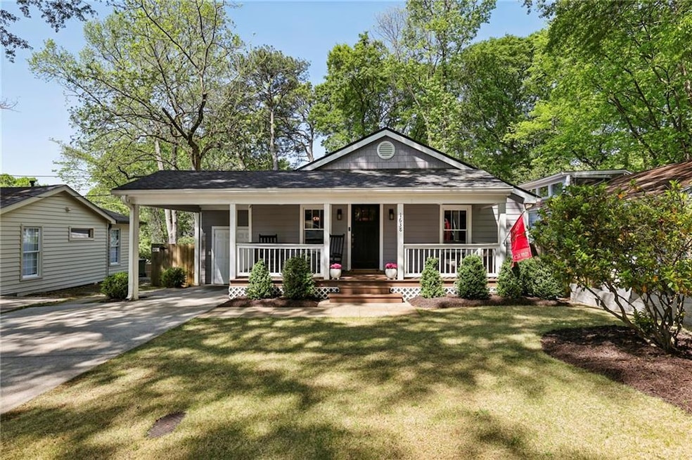 Bungalow-style house with a porch and a front lawn
