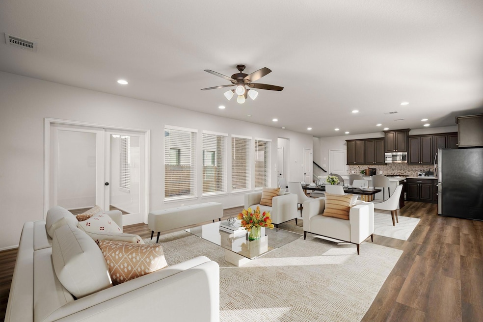 Living room featuring dark wood-style floors, vis