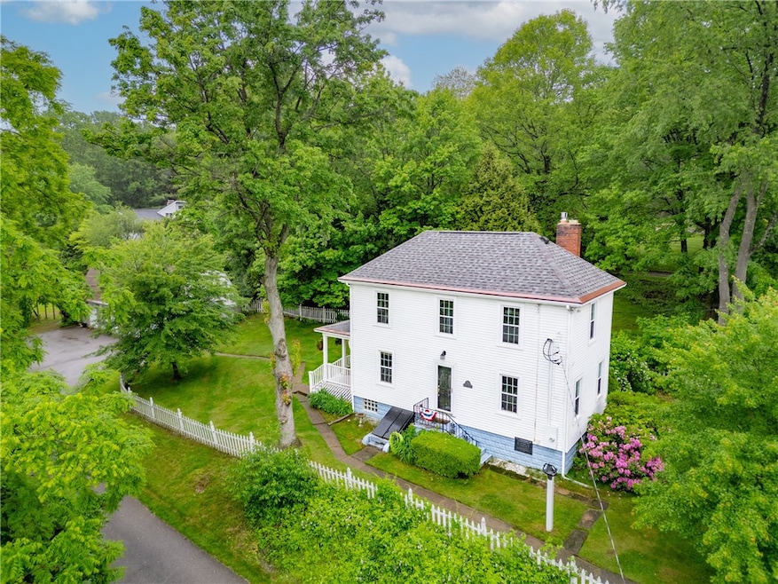 Main house with driveway, and detached garage with