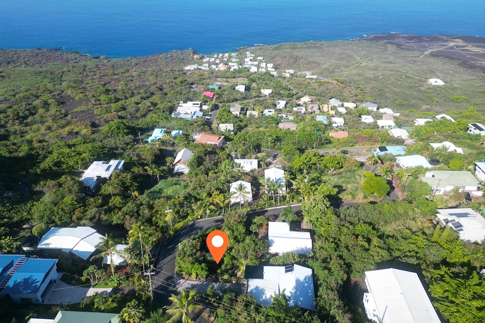 Welcome to your future homesite in Kona Paradise — a rare corner lot with wide ocean views and island sunsets.