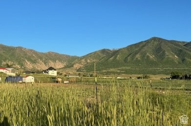 View of mountain background featuring rural landscape