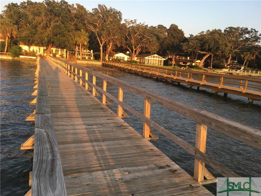 Welcome to this charming riverfront bungalow with 