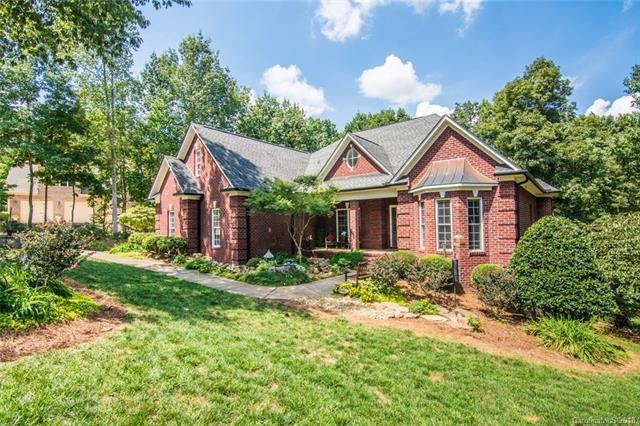 Custom Brick Home with relaxing front porch with W