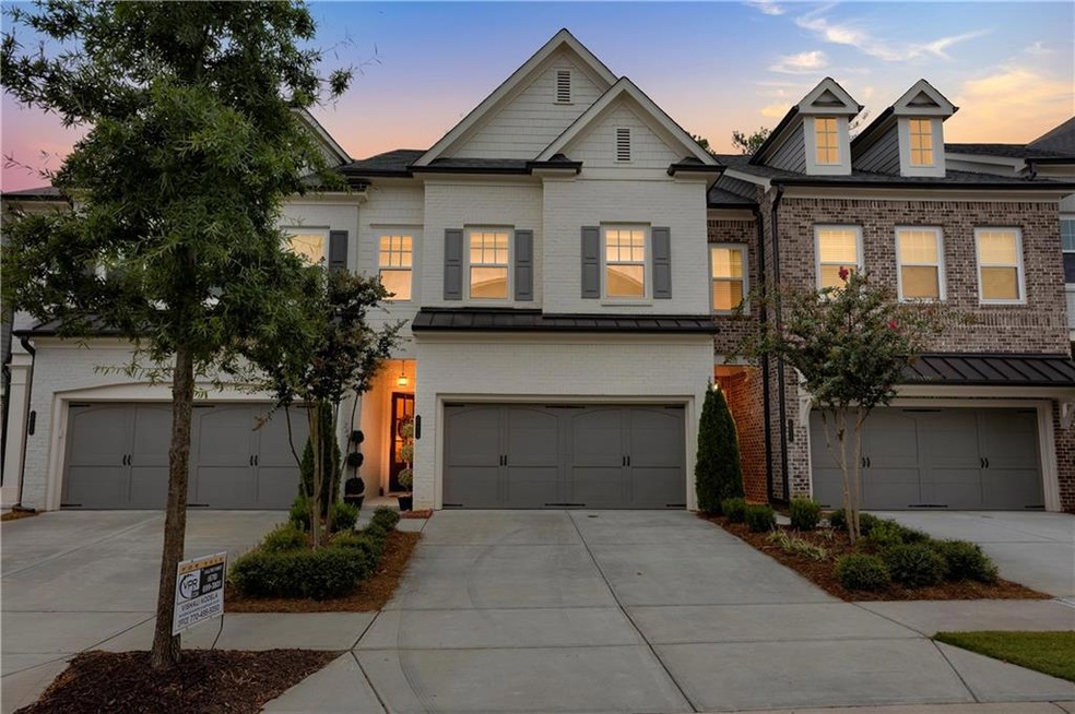 View of property featuring a garage