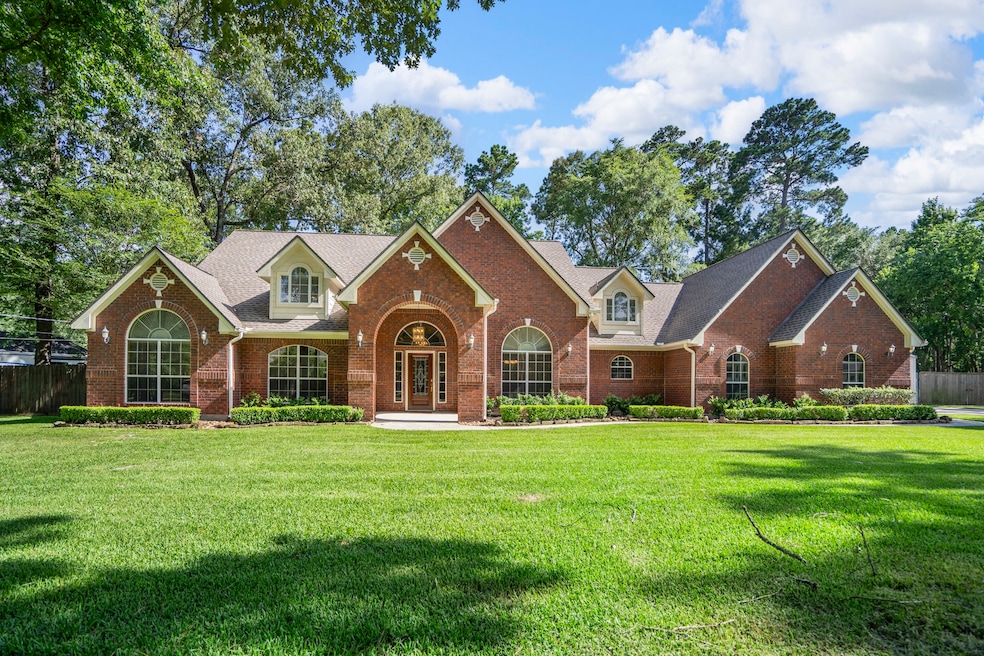 Set back on a .91-acre lot in Lake Creek Forest, t