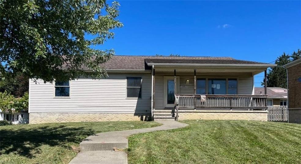 View of front facade with a front yard and a porch