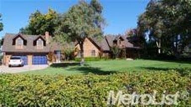 Beautiful cedar sided home on a 5 acre estate lot.