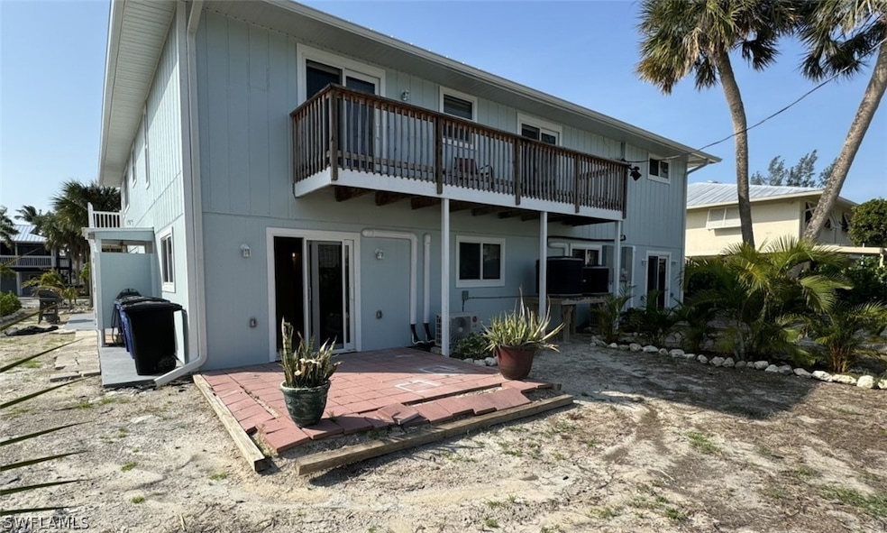 Back of house with a patio area