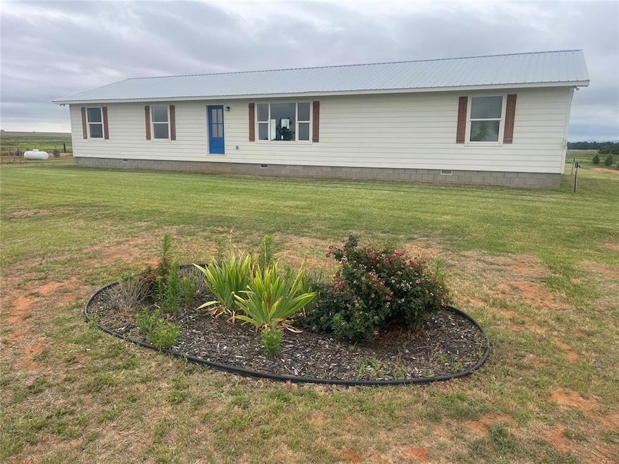 View of front of property with a front lawn