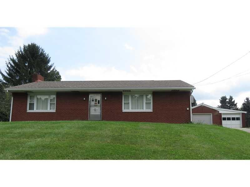 Exterior Front. Classic brick ranch home with spra