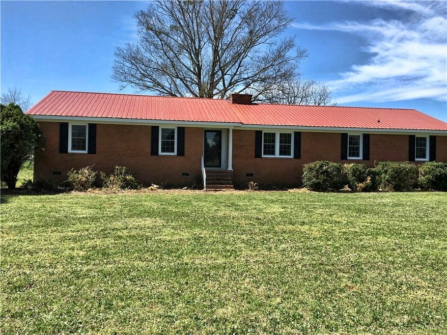 Newly remodeled brick ranch on over one acre.