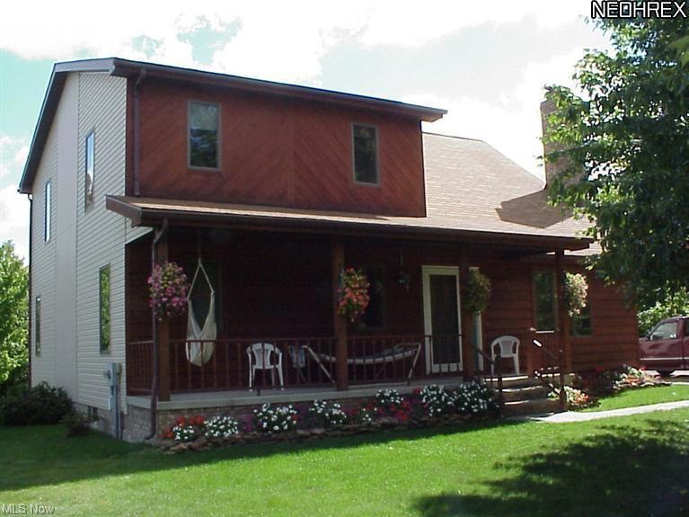 Relax on the private, front porch. House sits far 