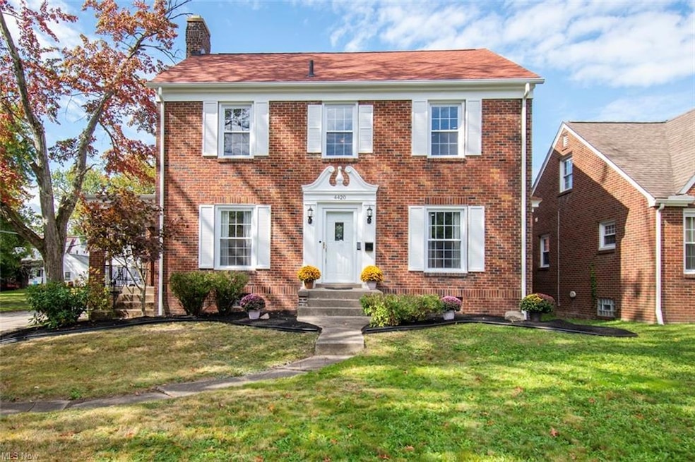 Colonial house with a front lawn